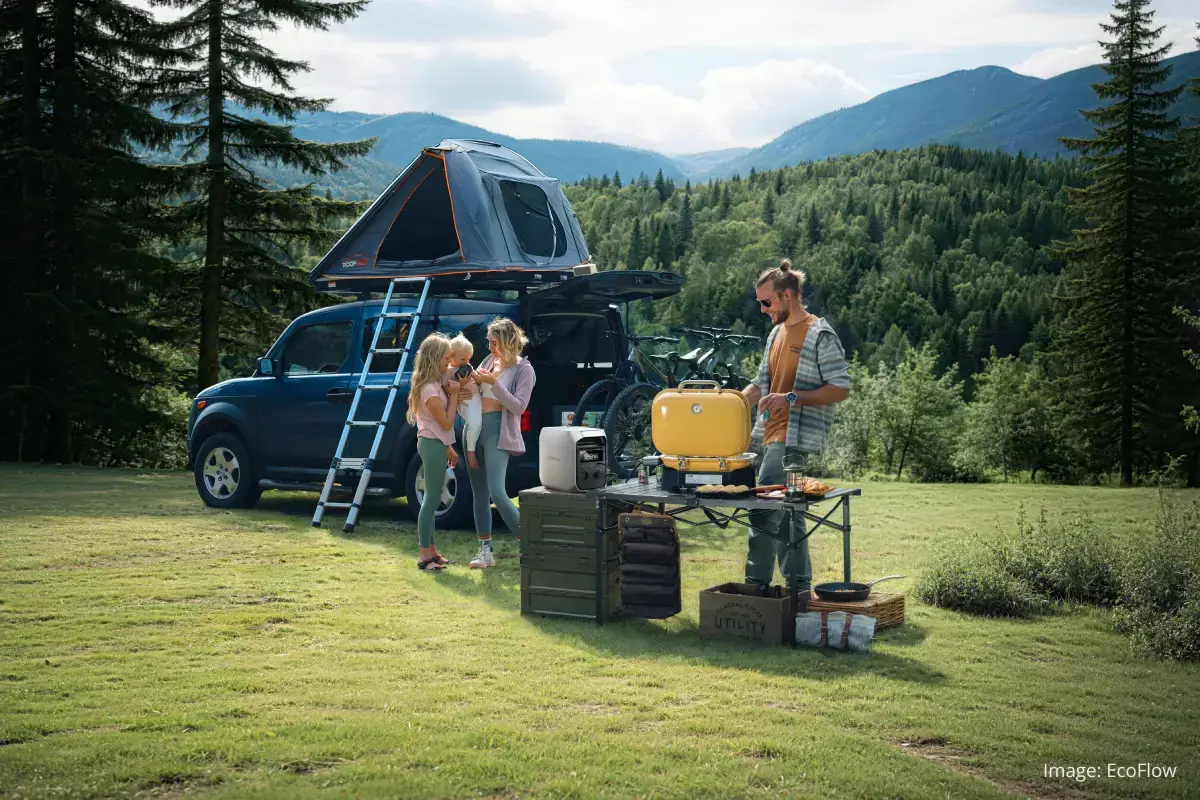 The EcoFlow DELTA 3 Classic power station outdoors with a mountain and forest background, showing its portability for camping and off-grid use. (Image: EcoFlow)