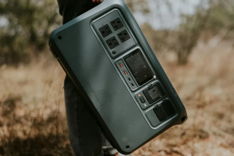 Portable solar generator for home backup power being carried outdoors for emergency electricity and off-grid energy use.