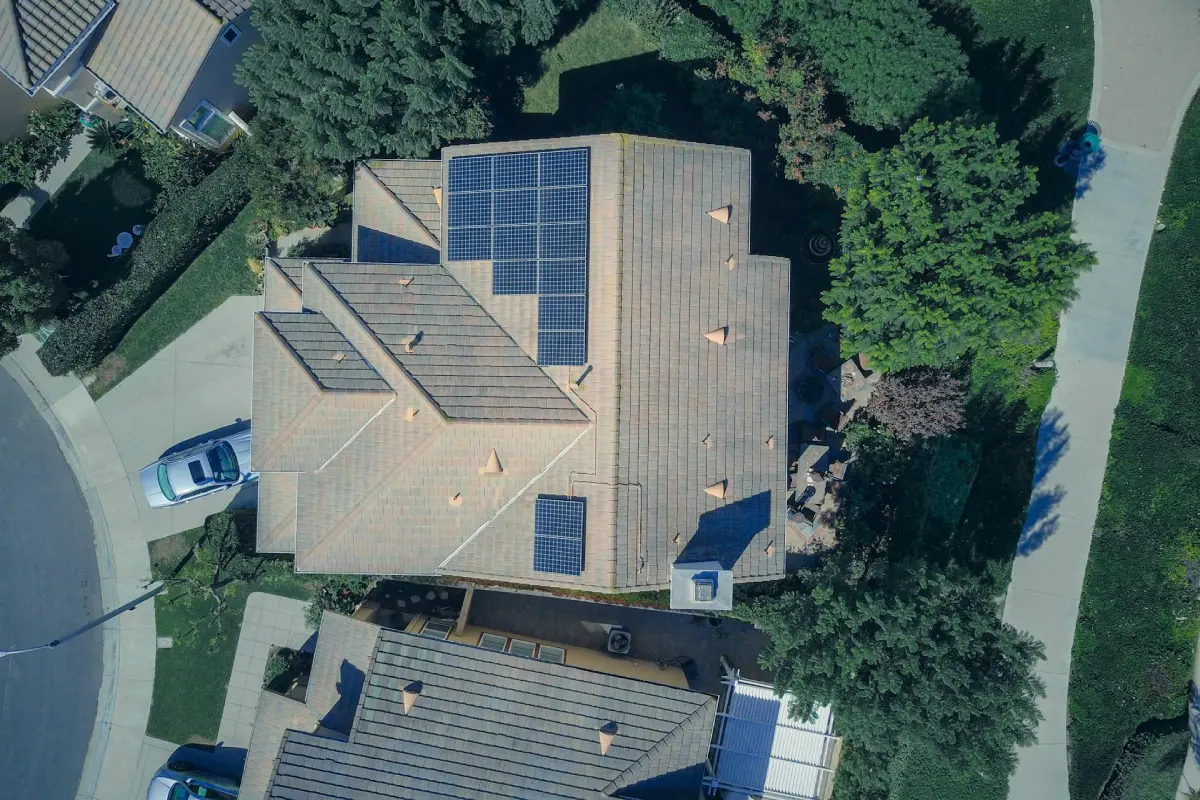 Solar panels installed on a house rooftop showing how many solar panels to power a house.