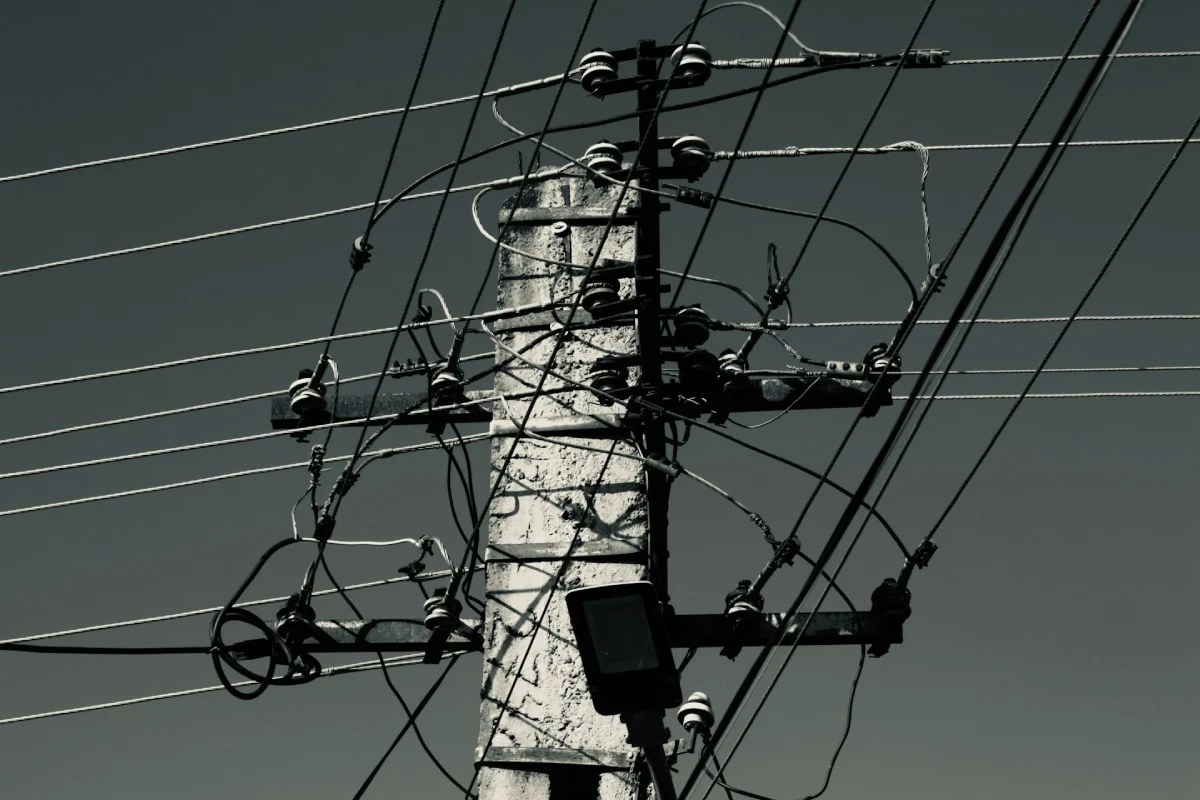 Electrical utility wires damaged during a blackout showing why homeowners should prepare for a power outage.