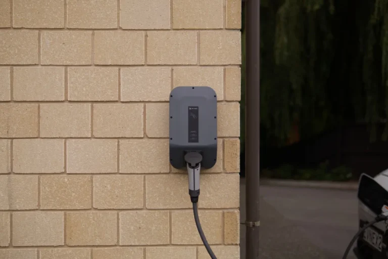 Wall-mounted home EV charger installation showing residential setup and electrical charging point for electric vehicles.