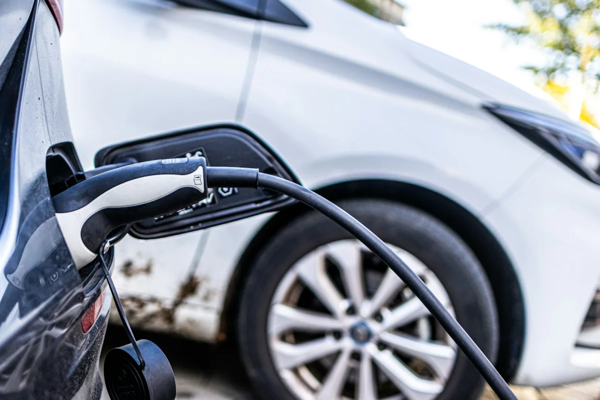 Electric vehicle charging at a home EV charger station showing Level 2 home charging installation and residential charging cost context.